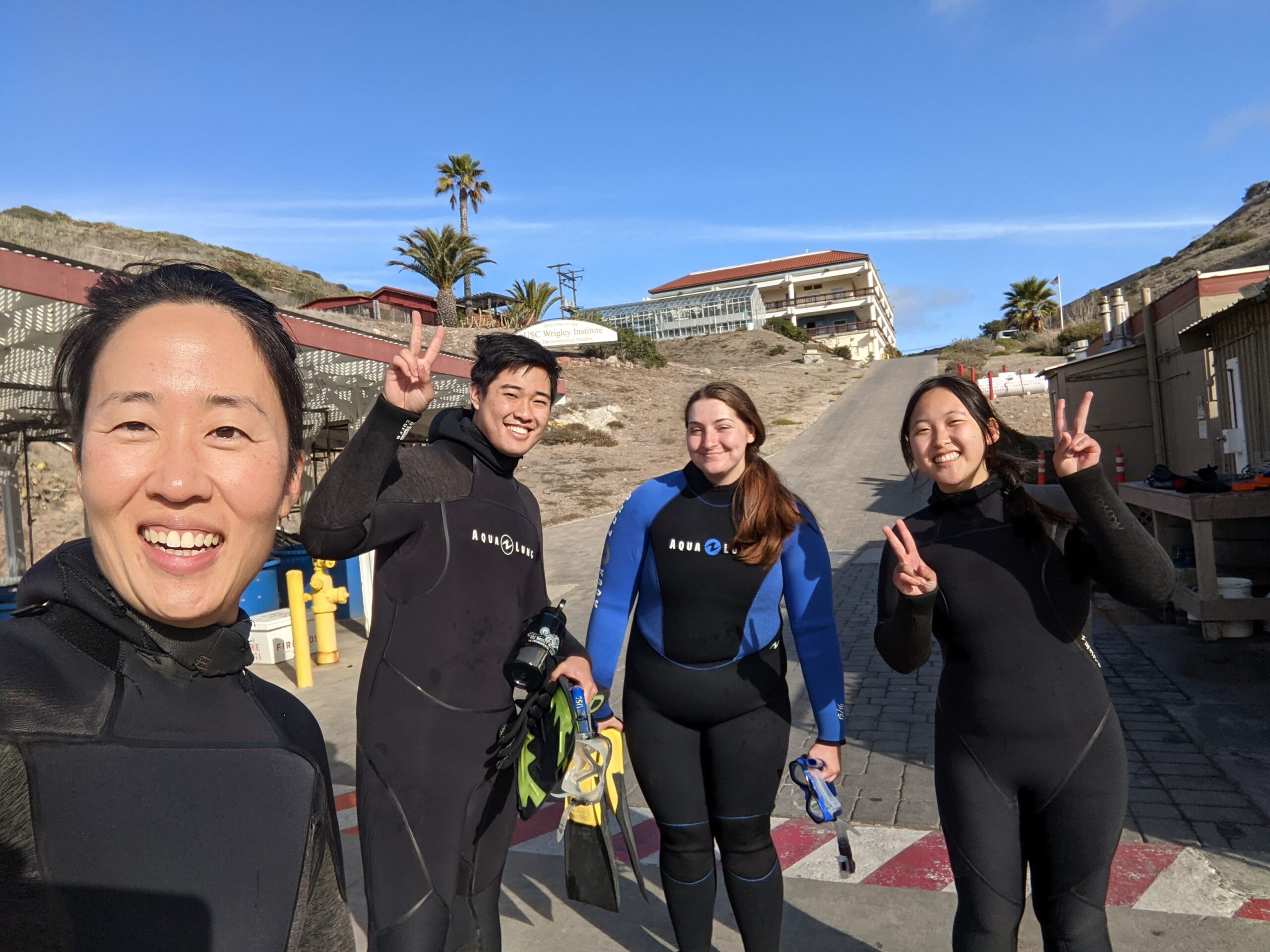 Wrigley Institute senior scientist Diane Kim with student interns before a dive
