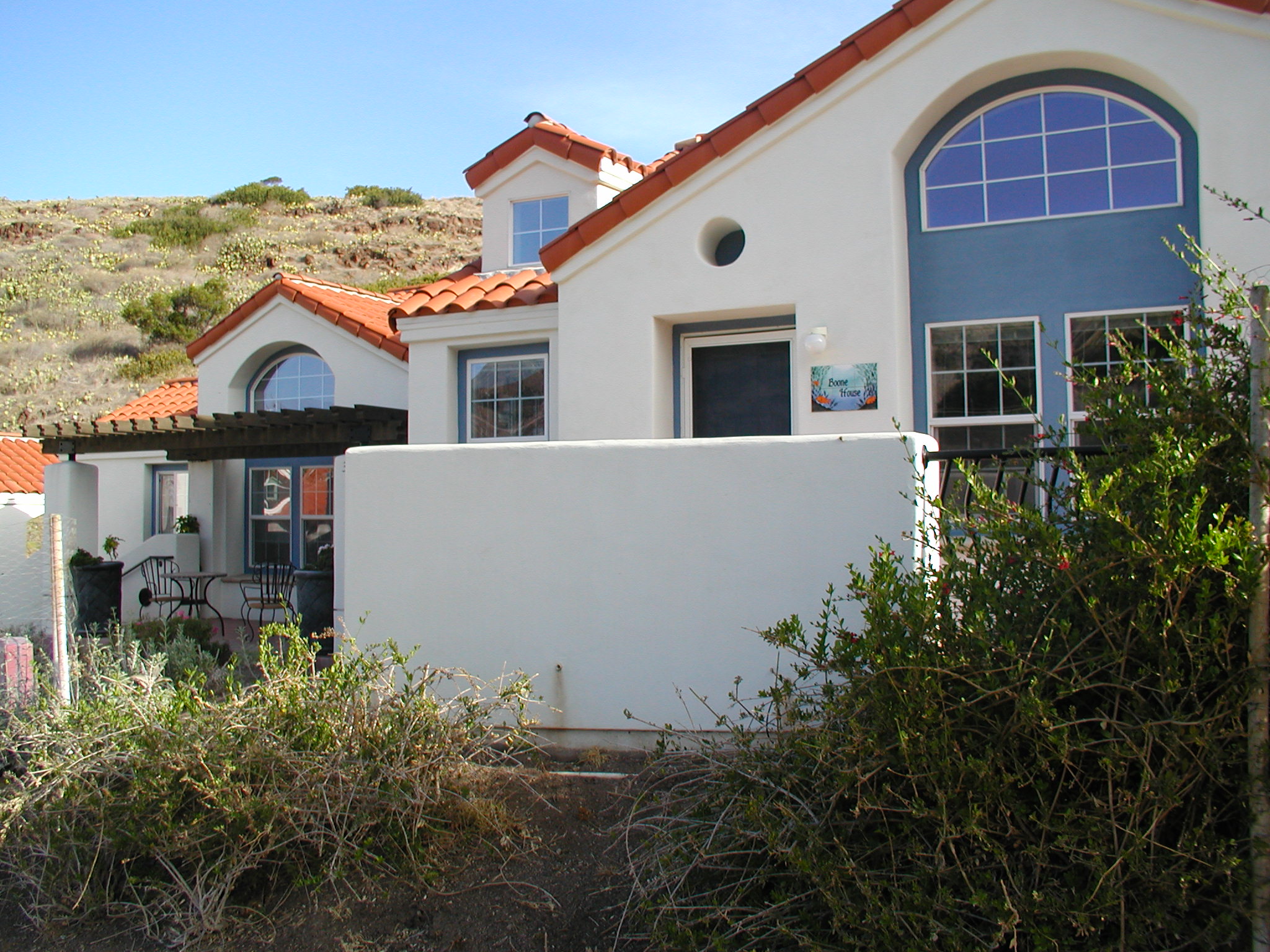 exterior of Wrigley Marine Science Center cottage housing, white buildings with red tile roofs