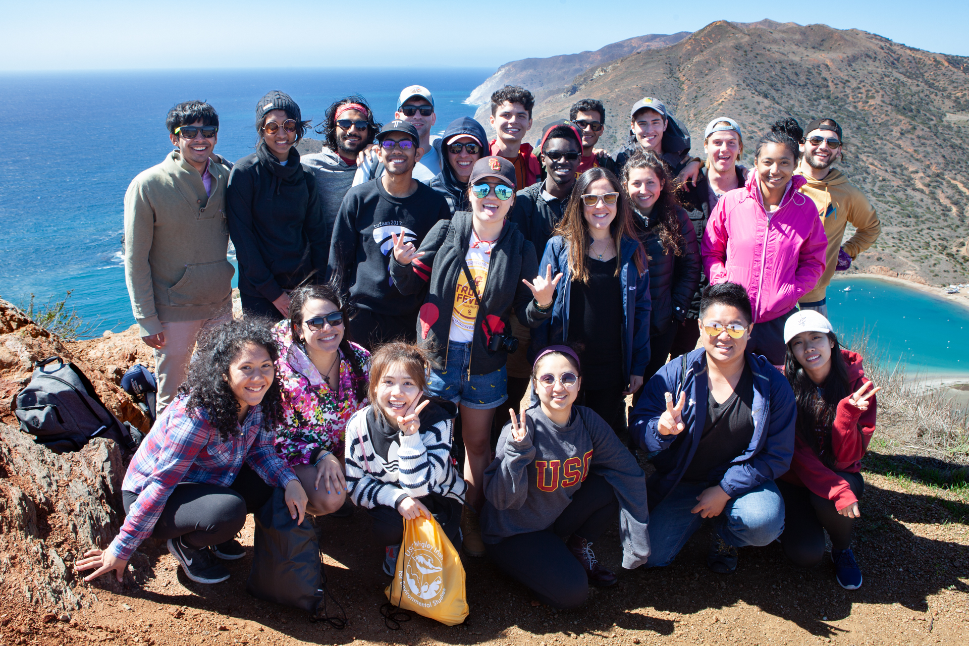 A group of students posing for a photo on a hill top on Catalina.