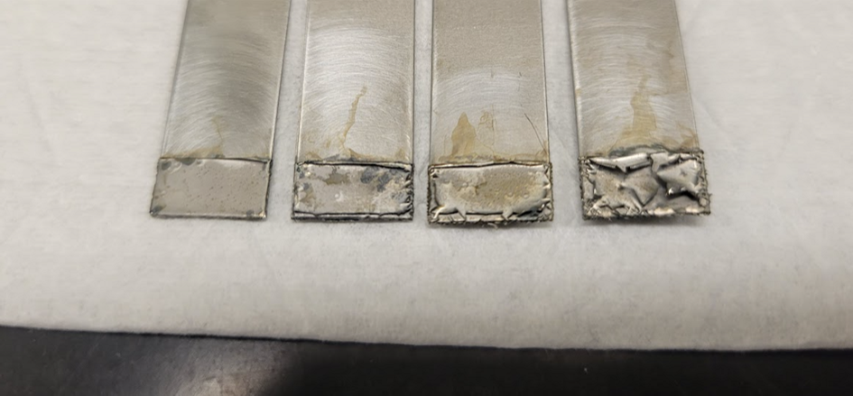 strips of stainless steel showing discoloration from iron deposits